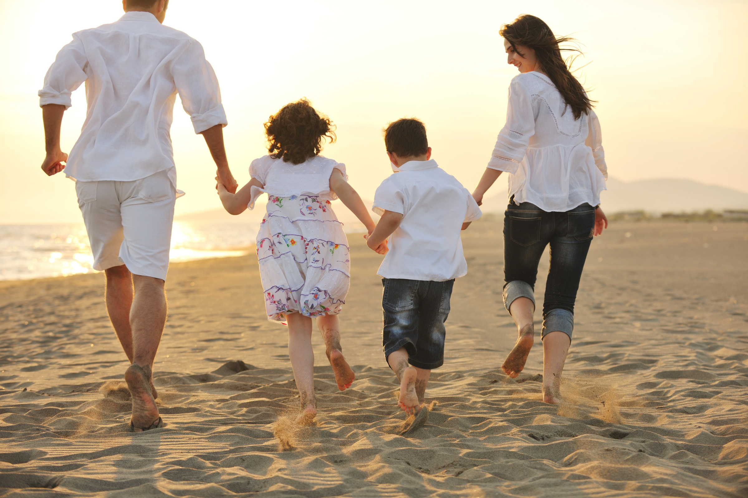 Family walking together on beach